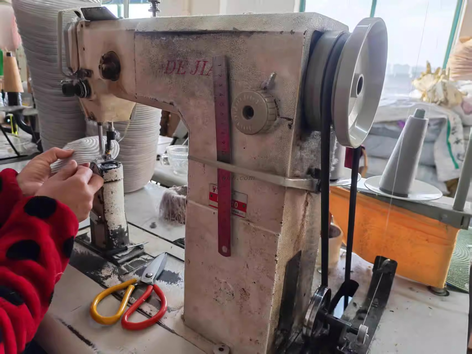 Sewing machine used in the hat factory production area
